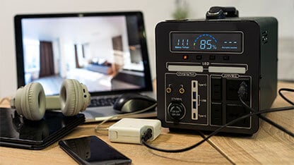 Portable power station solar electricity generator - laptop, phone, tablet and digital camera electronic devices charging. Wireless charging battery backup, power outage emergencies outdoors, camping. 